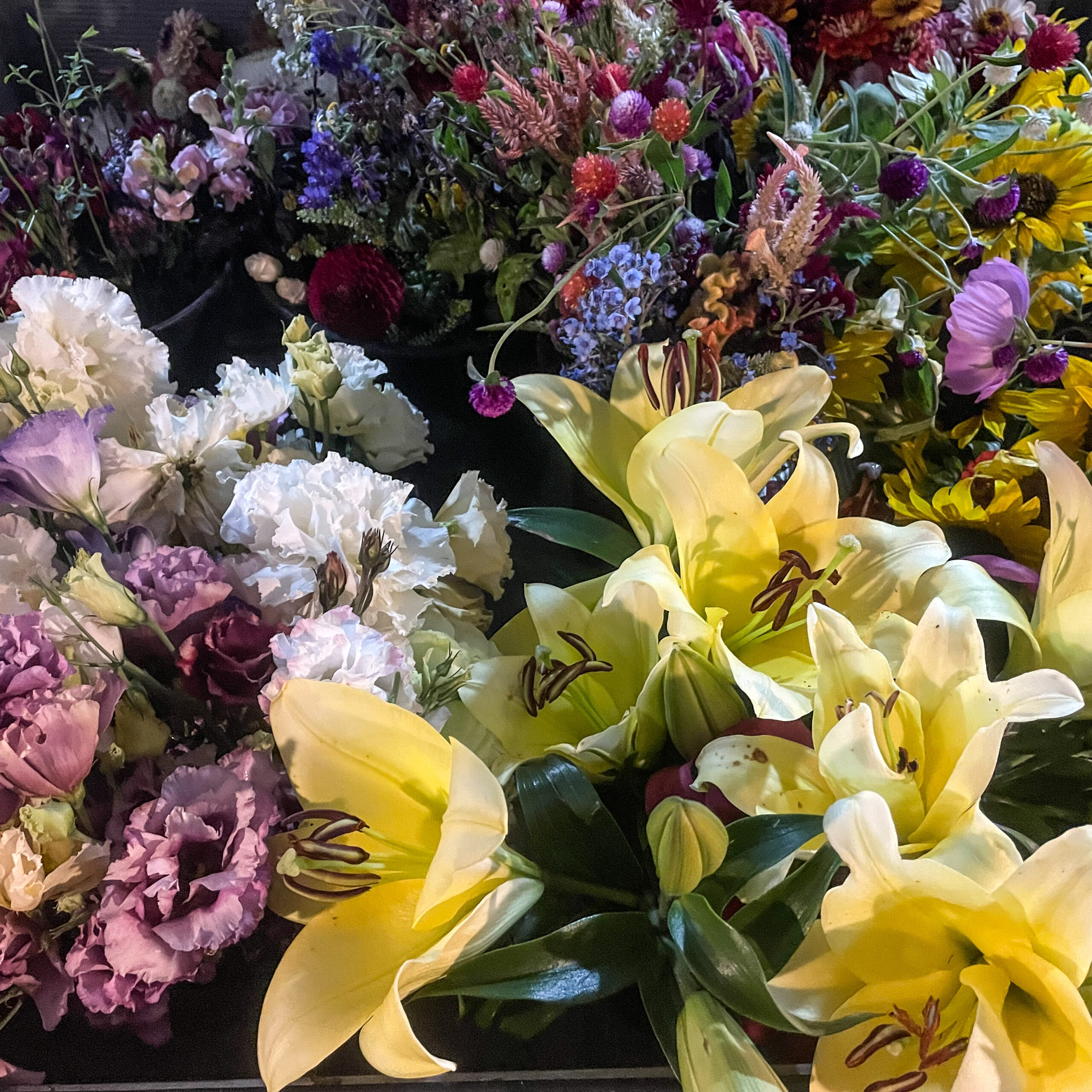 Many bouquets of flowers