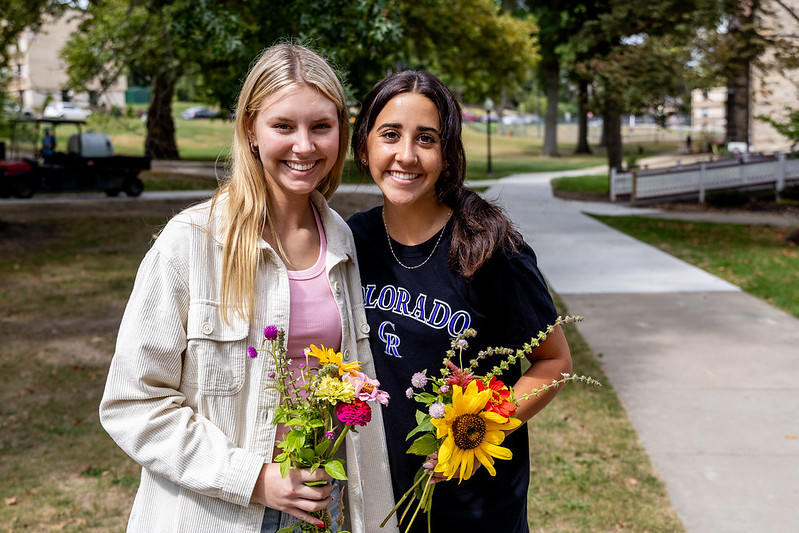 Students with bouquets made from the flower cart