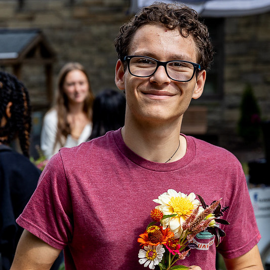 College student with bouquets made from the flower bar
