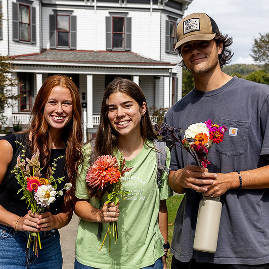 College students with bouquets made from the flower bar