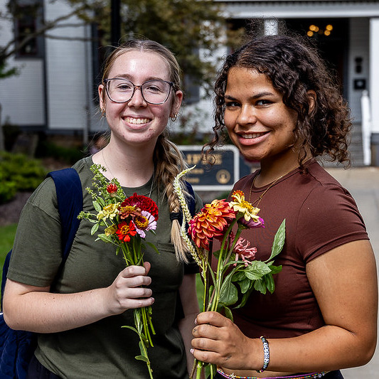College students with bouquets made from the flower bar