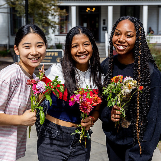 College students with bouquets made from the flower bar