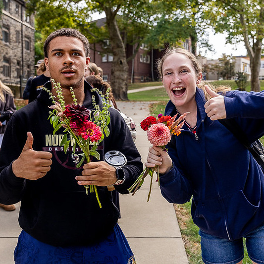 College students with bouquets made from the flower bar