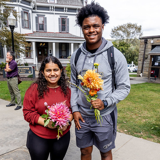 College students with bouquets made from the flower bar