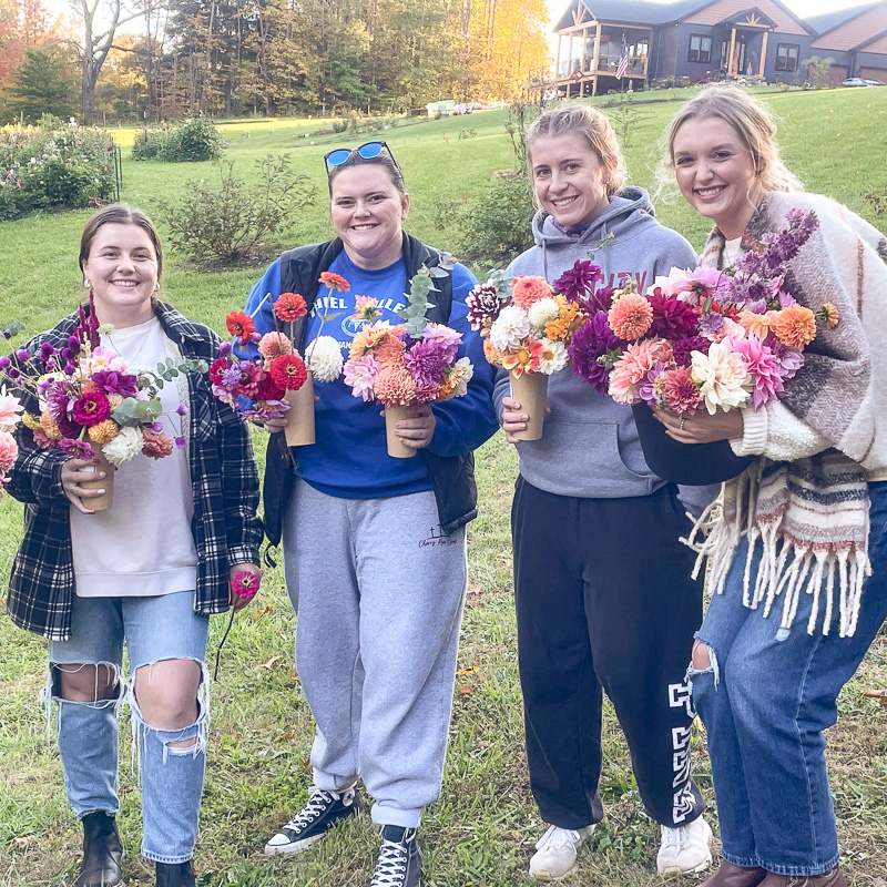 College students picking flowers on the farm