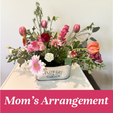 A Specialty arrangement for Mother's Day in a tin basket.